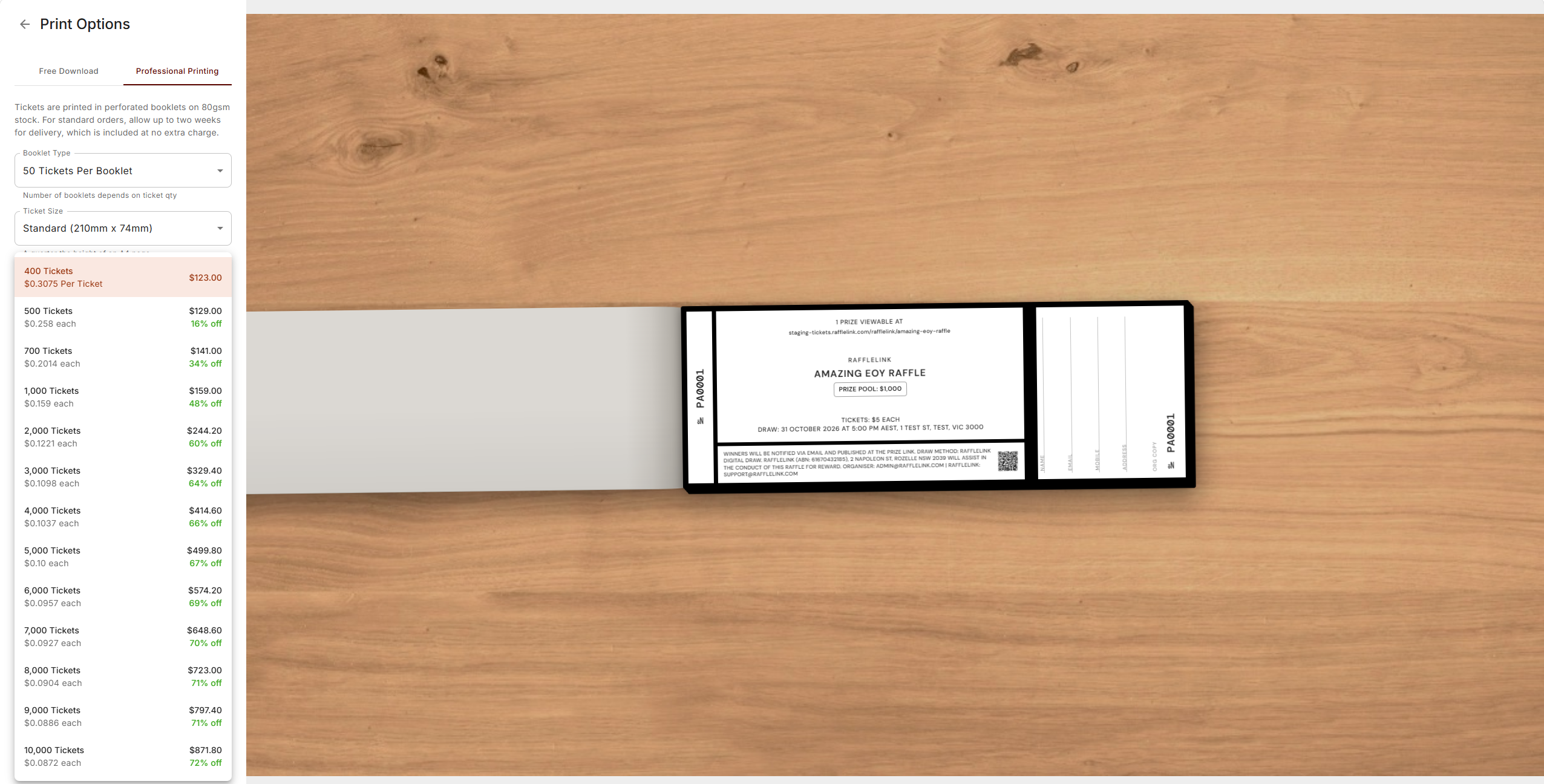 The Professional Printing tab with the quantity list open, showing all thirteen tiers from 400 tickets up to 10,000 with their prices and per-ticket discounts, beside a preview of the printed ticket.